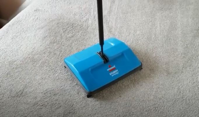 clean carpet using Carpet Sweeper 