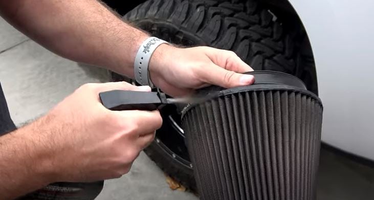 Spray Cleaning Liquid onto the Air Filter