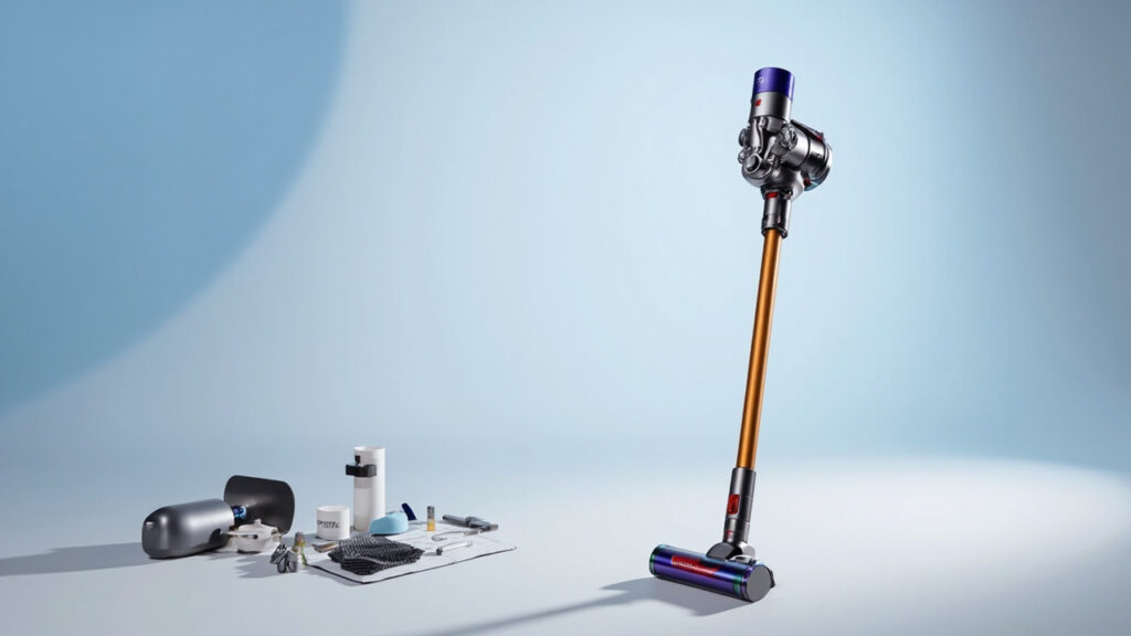 Dyson vacuum cleaner with toolkit for troubleshooting maintenance on clean white surface