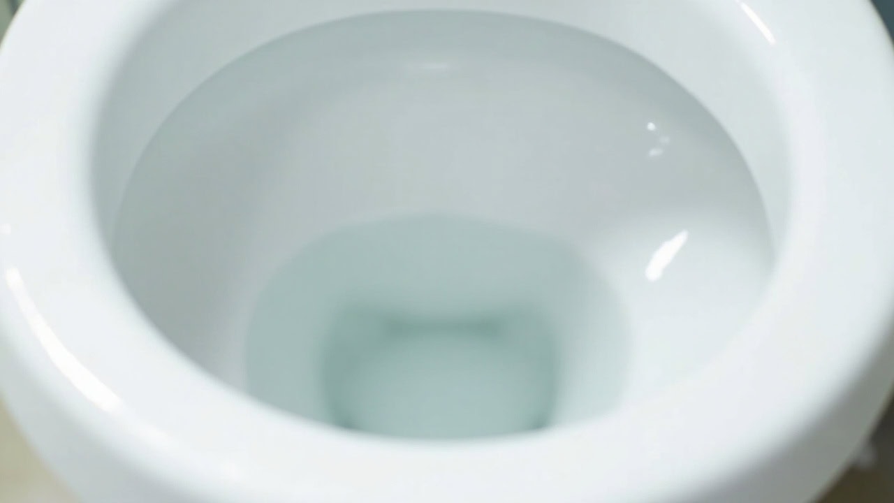 Clean white toilet bowl interior showing pristine porcelain surface with no stains or mineral deposits