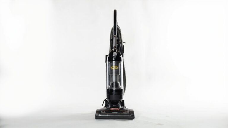 "Kirby upright vacuum cleaner with accessible filter compartment and brush roll visibility"